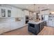 Elegant kitchen with custom cabinetry, stainless steel appliances, and a large center island at 18868 E Mockingbird Dr, Queen Creek, AZ 85142