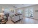 Living room with fireplace, built-in shelving, and French doors to the yard at 18868 E Mockingbird Dr, Queen Creek, AZ 85142