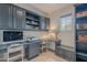 Well-lit home office with custom built-ins, desk, and ample storage, perfect for a productive workspace at 18868 E Mockingbird Dr, Queen Creek, AZ 85142