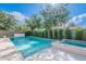 Enjoy this sparkling pool with spa and travertine surround, perfect for backyard fun and relaxation at 18868 E Mockingbird Dr, Queen Creek, AZ 85142