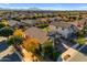 Aerial shot showing the property's position in a vibrant neighborhood with mountain views at 20765 E Raven Dr, Queen Creek, AZ 85142
