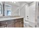 Well-lit bathroom features a granite vanity, shower-tub combo, and neutral finishes, offering a clean aesthetic at 20765 E Raven Dr, Queen Creek, AZ 85142