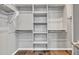 The walk-in closet has built-in shelving and plenty of storage space at 20765 E Raven Dr, Queen Creek, AZ 85142