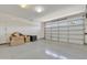 Spacious garage with an epoxy floor and ample storage space, offering both functionality and appeal at 20765 E Raven Dr, Queen Creek, AZ 85142