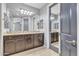 This main bathroom features a double vanity with granite countertops, tile floors, and great lighting at 20765 E Raven Dr, Queen Creek, AZ 85142