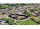 An aerial view of community pickle ball court near houses, golf course, and a pond at 20801 N 90Th Pl # 271, Scottsdale, AZ 85255