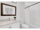 A pristine white bathroom features a marble countertop, vanity, and shower-tub combination at 20801 N 90Th Pl # 271, Scottsdale, AZ 85255