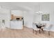 Dining area featuring contemporary lighting, dining table, and an open view into the adjacent kitchen at 20801 N 90Th Pl # 271, Scottsdale, AZ 85255