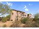 Beautiful multi-story stucco home with tile roof surrounded by lush desert landscaping at 20801 N 90Th Pl # 271, Scottsdale, AZ 85255