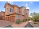 Charming two-story stucco home featuring a terracotta tile roof and attached garages at 20801 N 90Th Pl # 271, Scottsdale, AZ 85255
