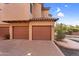 Attached garages on a brick driveway with terracotta roof at 20801 N 90Th Pl # 271, Scottsdale, AZ 85255