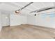 Clean, white-walled garage with an automatic door and ample lighting at 20801 N 90Th Pl # 271, Scottsdale, AZ 85255