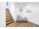 Hallway with staircase, bench, and decorative wall accents creating an inviting and stylish entryway at 20801 N 90Th Pl # 271, Scottsdale, AZ 85255