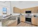 Well-equipped kitchen with stainless steel appliances, granite countertops, and ample cabinet space at 20801 N 90Th Pl # 271, Scottsdale, AZ 85255
