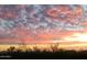 Colorful dusk landscape view features vibrant clouds and desert brush in silhouette at 20801 N 90Th Pl # 271, Scottsdale, AZ 85255