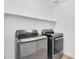 Modern laundry room equipped with front loading washer and dryer and a shelf at 20801 N 90Th Pl # 271, Scottsdale, AZ 85255