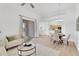 Open concept living and dining area with natural light and sliding glass door to the outdoor balcony at 20801 N 90Th Pl # 271, Scottsdale, AZ 85255