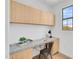 Well-lit office area features built in desk with granite countertops and ample cabinet storage at 20801 N 90Th Pl # 271, Scottsdale, AZ 85255