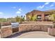 Community outdoor kitchen with a built-in grill and stone countertops at 20801 N 90Th Pl # 271, Scottsdale, AZ 85255
