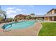 Inviting community pool with a stone deck and well-maintained landscaping at 20801 N 90Th Pl # 271, Scottsdale, AZ 85255