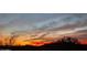Dramatic landscape view showcasing an orange, yellow, and blue sunset sky at 20801 N 90Th Pl # 271, Scottsdale, AZ 85255