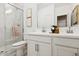 Bright bathroom featuring double sink vanity and glass enclosed shower at 23417 W Burton Ave, Buckeye, AZ 85326