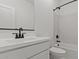 Modern bathroom with a large vanity, sleek fixtures, and a bathtub-shower combo at 23417 W Burton Ave, Buckeye, AZ 85326