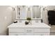 Well-lit bathroom with double vanity and stylish fixtures at 23417 W Burton Ave, Buckeye, AZ 85326