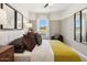 Well-lit bedroom with plush bedding and modern furnishings at 23417 W Burton Ave, Buckeye, AZ 85326