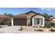Charming single-story home with stone accents, desert landscaping, and a welcoming facade at 23417 W Burton Ave, Buckeye, AZ 85326