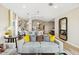 Stylish living room with contemporary furniture, open-concept design, and kitchen view at 23417 W Burton Ave, Buckeye, AZ 85326