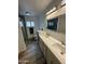Bright bathroom showcasing a double sink vanity with stylish mirror and walk-in shower at 2426 E Turquoise Dr, Phoenix, AZ 85028
