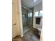 Bathroom featuring a large shower with glass doors and neutral tile at 2426 E Turquoise Dr, Phoenix, AZ 85028