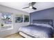 Bedroom featuring a bed, a large window, and paintings at 2426 E Turquoise Dr, Phoenix, AZ 85028