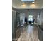 A refrigerator partially obscures view into the dining room with view of desert landscape through the window at 2426 E Turquoise Dr, Phoenix, AZ 85028