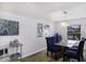 Elegant dining area with modern chandelier, stylish furniture, and scenic outdoor view at 2426 E Turquoise Dr, Phoenix, AZ 85028