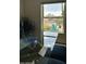 Bright dining area features a large window with views of desert flora and a mountain in the distance at 2426 E Turquoise Dr, Phoenix, AZ 85028