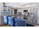 Contemporary kitchen featuring granite countertops, stainless steel appliances, and stylish bar seating at 2426 E Turquoise Dr, Phoenix, AZ 85028