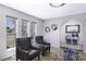 Sitting room featuring comfortable chairs, decorative mirrors, glass coffee table, and lots of light at 2426 E Turquoise Dr, Phoenix, AZ 85028