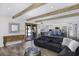 Spacious living room featuring wood flooring, exposed beams, and modern furniture at 2426 E Turquoise Dr, Phoenix, AZ 85028
