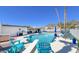 Backyard with a sparkling pool, diving board, outdoor kitchen, and comfortable lounge area, perfect for relaxation at 2426 E Turquoise Dr, Phoenix, AZ 85028