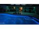 Outdoor pool and patio lit up at night, showing outdoor dining and lounging at 2426 E Turquoise Dr, Phoenix, AZ 85028