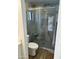 Bathroom showcases a glass-enclosed shower with gray stone-look tile and a built-in bench at 2426 E Turquoise Dr, Phoenix, AZ 85028