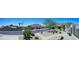 Street view of home with desert landscaping, mountain views, and palm trees at 2426 E Turquoise Dr, Phoenix, AZ 85028