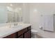 Clean bathroom featuring a sink with a toilet and a shower in the background at 2660 S Equestrian Dr # 103, Gilbert, AZ 85295