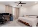 Relaxing bedroom with a neutral color palette, a cozy bed, and a dedicated workspace at 2660 S Equestrian Dr # 103, Gilbert, AZ 85295
