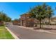 A brick gate house in a private community with mature trees and landscaping at 2660 S Equestrian Dr # 103, Gilbert, AZ 85295