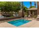 Community hot tub area overlooking a pond and trees at 2660 S Equestrian Dr # 103, Gilbert, AZ 85295
