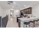 Modern kitchen featuring a breakfast bar, stainless steel appliances, and sleek countertops at 2660 S Equestrian Dr # 103, Gilbert, AZ 85295