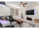 Inviting living room featuring a modern entertainment setup, neutral tones, and stylish furnishings at 2660 S Equestrian Dr # 103, Gilbert, AZ 85295